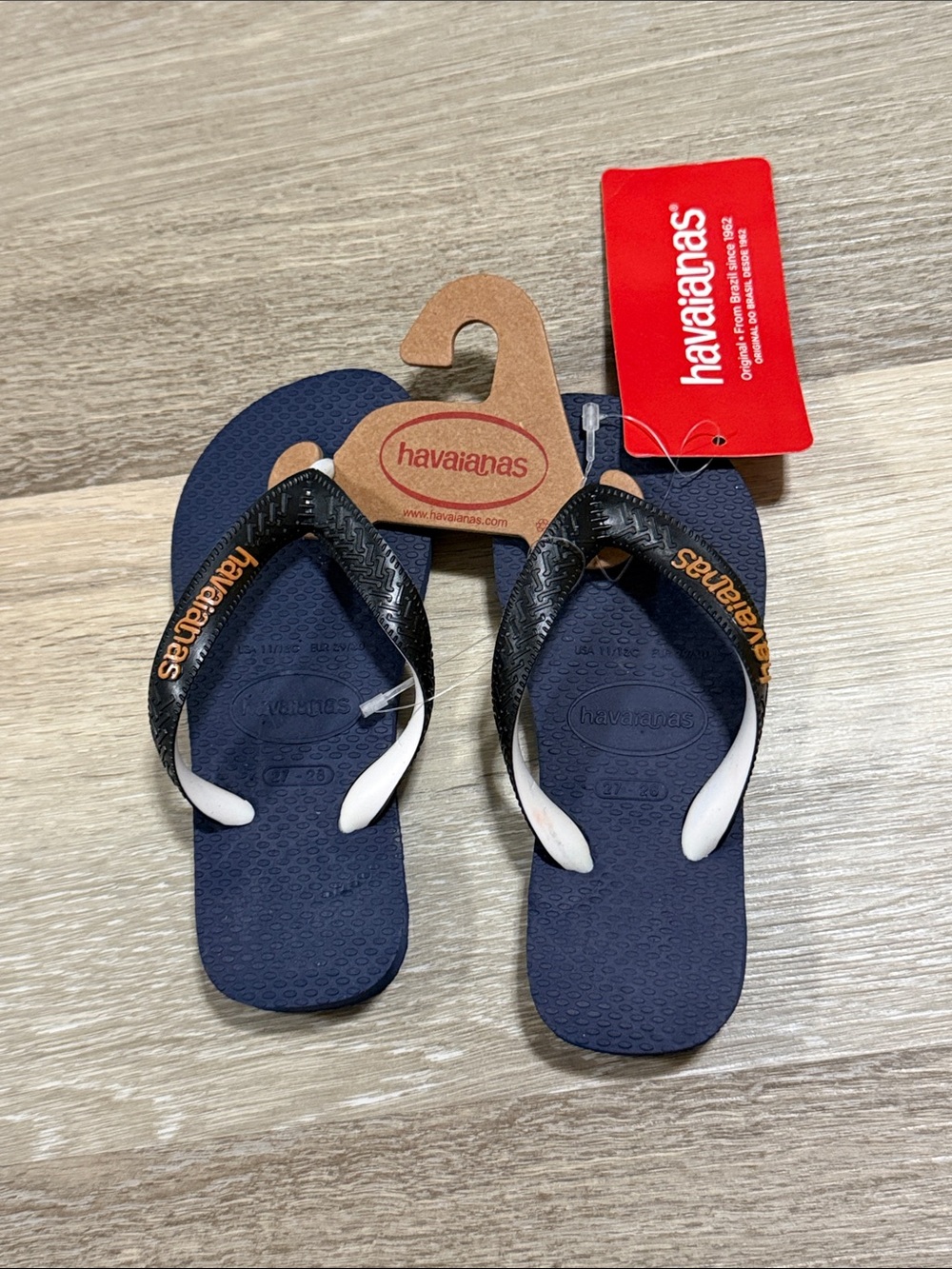 Havaianas Kids Navy Flip Flops with Black and White Straps and Orange Logo